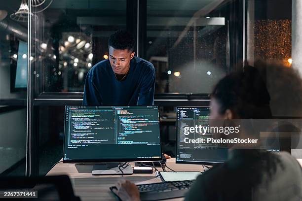 software developers in modern office collaborating analysing the coding on computer screen. - problem solution stock pictures, royalty-free photos & images