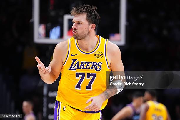 Luka Doncic of the Los Angeles Lakers reacts after scoring a three-pointer against the Miami Heat during the third quarter at Kaseya Center on March...