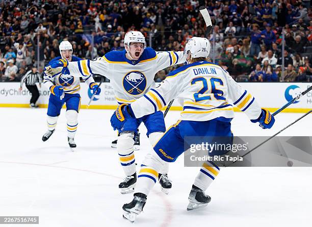 Zach Benson of the Buffalo Sabres celebrates his goal with Rasmus Dahlin of the Buffalo Sabres during the third period against the Anaheim Ducks at...