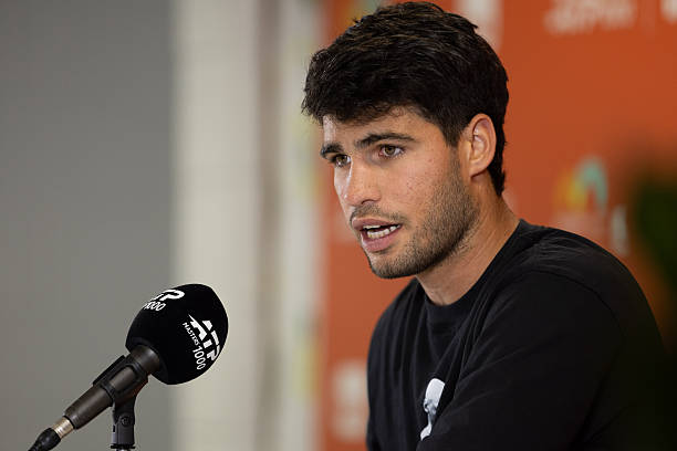 Carlos Alcaraz speaks to the media after his defeat against Sebastian Korda of the United States during their match on Day 6 of the Miami Open at...