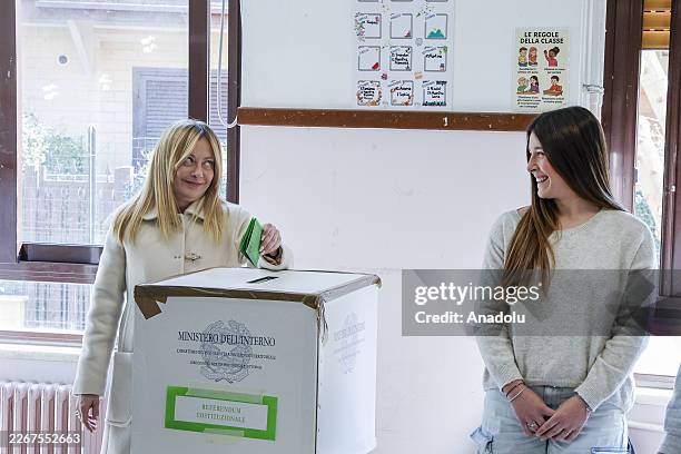 Italian Premier Giorgia Meloni casts her ballot after voting in a constitutional referendum on a reform of the Italian judicial system at a polling...