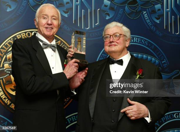 Film Critic Roger Ebert receives a special award of recognition from cinematographer Haskell Wexler at the American Society of Cinematographers 17th...
