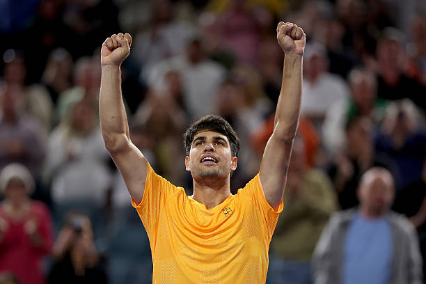 Carlos Alcaraz of Spain celebrates his win over Joao Fonseca of Brazil on Day 4 of the Miami Open Presented by Itau at Hard Rock Stadium on March 20,...