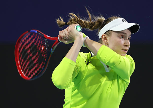 Elena Rybakina of Kazakhstan returns a shot against Yulia Putintseva of Kazakhstan during Day 3 of the Miami Open at Hard Rock Stadium on March 19,...