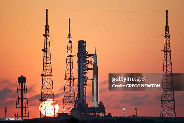 S Artemis II Space Launch System rocket and Orion spacecraft are seen at sunrise at Launch Pad 39B at the Kennedy Space Center in Cape Canaveral,...