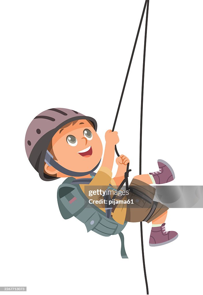 Boy climbing on a rock mountain with equipment. Climbing the mountains.
