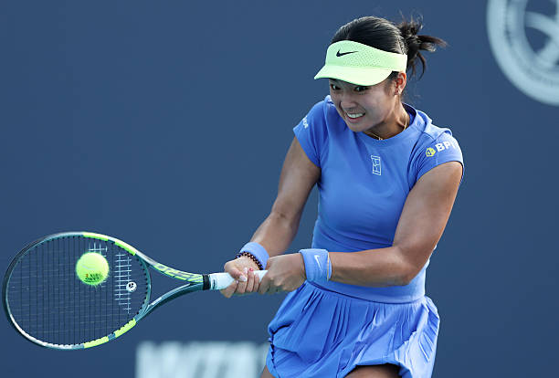 Alexandra Eala of the Philippines returns a shot against Magda Linette of Poland during Day 5 of the Miami Open at Hard Rock Stadium on March 21,...