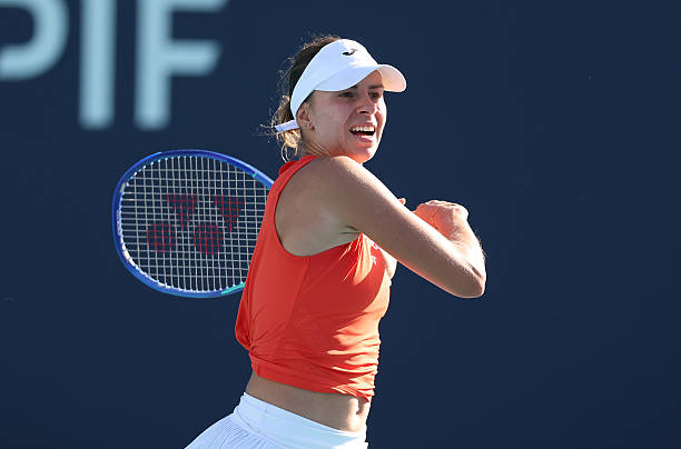 Magda Linette of Poland returns a shot against Alexandra Eala of the Philippines during Day 5 of the Miami Open at Hard Rock Stadium on March 21,...