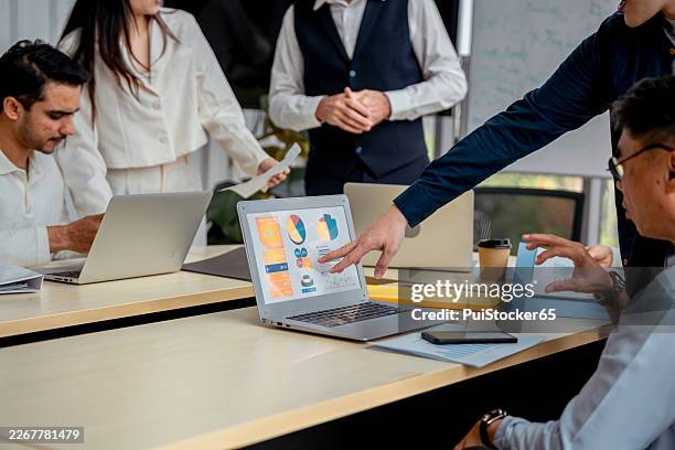 a diverse finance team discussing investment strategies. a strategic planning meeting among business professionals. - venture capital stock pictures, royalty-free photos & images