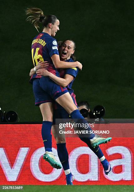 Barcelona's Polish forward Ewa Pajor celebrates with Barcelona's Spanish midfielder Clara Serrajordi after scoring her team's fourth goal during the...