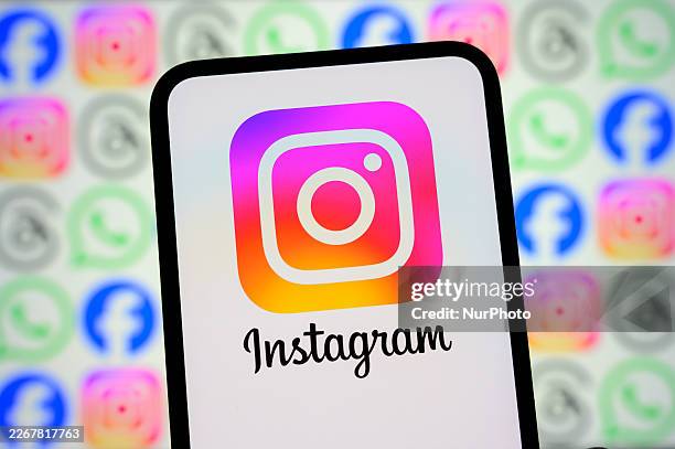 The Instagram logo appears on a smartphone screen in front of a screen showing icons for Facebook, Instagram, WhatsApp, and other Meta apps, in...