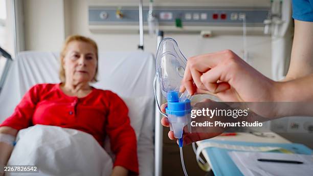 asthma copd breath nebulizer and mask given by doctor - nebulizer stock pictures, royalty-free photos & images
