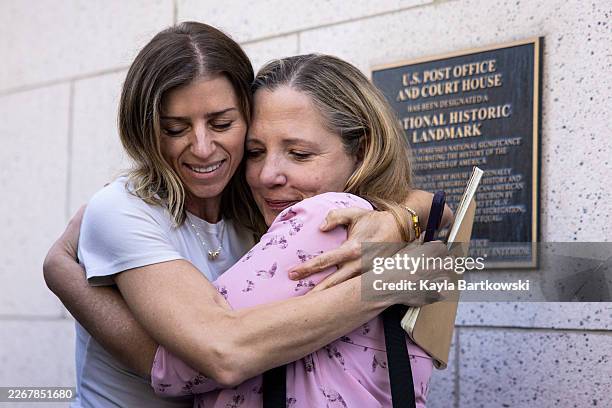 Supporters and family of the victims Nicki Petrossi, left, and mother of the victim Riley, Mary Rodee embrace after hearing the verdict in front of...
