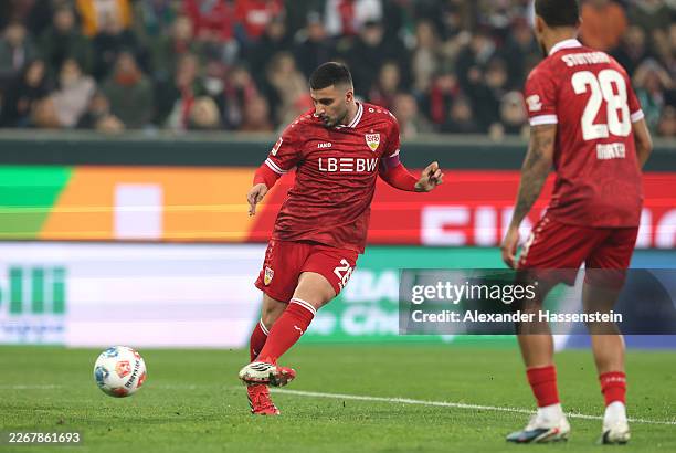Deniz Undav of VfB Stuttgart scores his team's first goal during the Bundesliga match between FC Augsburg and VfB Stuttgart at WWK-Arena on March 22,...