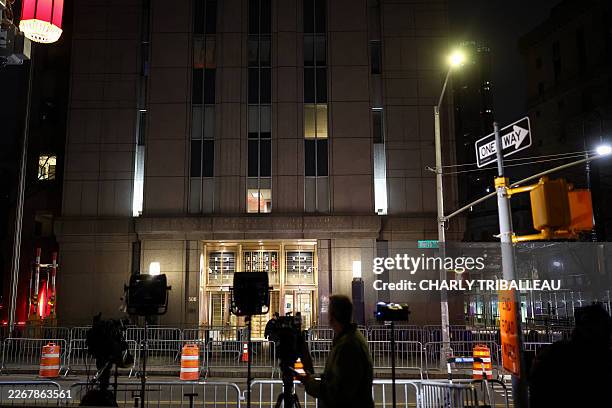 Journalists wait in front of the Daniel Patrick Moynihan United States Courthouse as a convoy believed to be carrying ousted Venezuelan president...