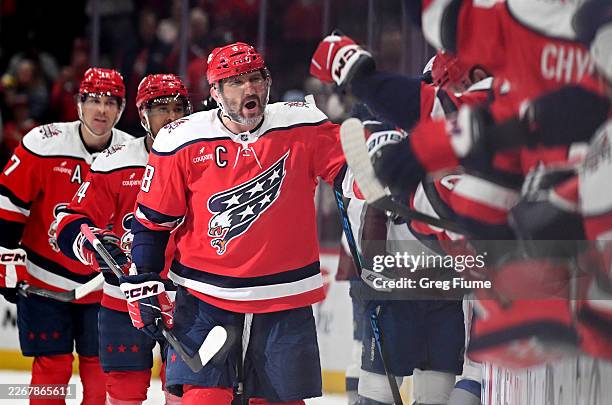 Alex Ovechkin of the Washington Capitals celebrates with teammates after scoring in the third period against the Colorado Avalanche at Capital One...