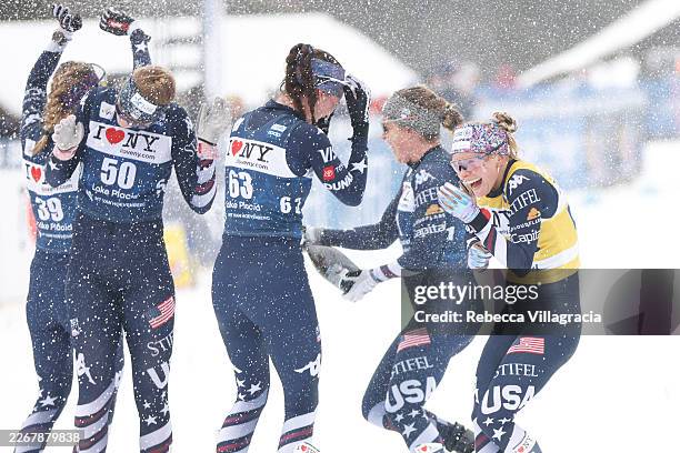 Jessie Diggins of Team United States celebrates with her team following the Women's 20km Mass Start Free during the FIS World Cup Cross-Country on...