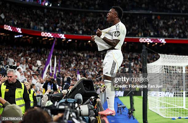 Vinicius Junior of Real Madrid celebrates scoring his team's third goal during the LaLiga EA Sports match between Real Madrid CF and Atletico de...