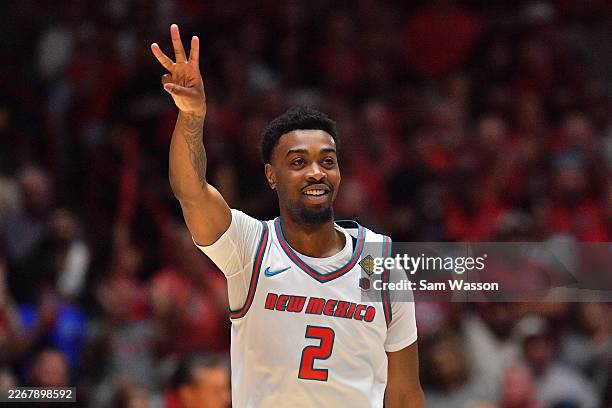 Tajavis Miller of the New Mexico Lobos celebrates after hitting a 3-pointer against the George Washington Revolutionaries during the first half of a...