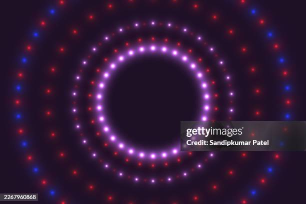 scattered blue-pink neon particles on a dark background - dust explosion stock illustrations