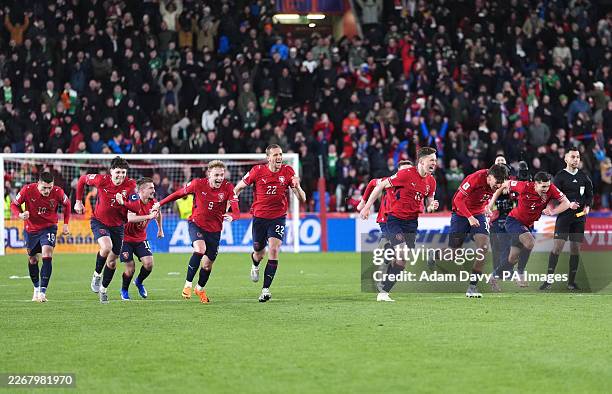 Czechia players celebrate victory following a penalty shootout after extra time in the 2026 FIFA World Cup European Play-off Semi-final match at the...