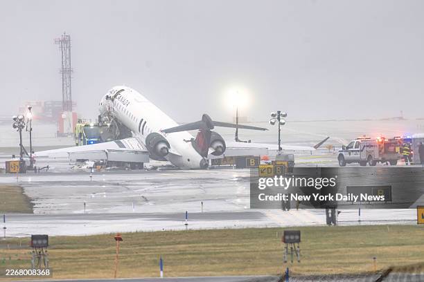 An Air Canada Express CRJ-900 sits on the runway at LaGuardia Airport on March 23, 2026. The pilot and co-pilot of the Air Canada jetliner were...