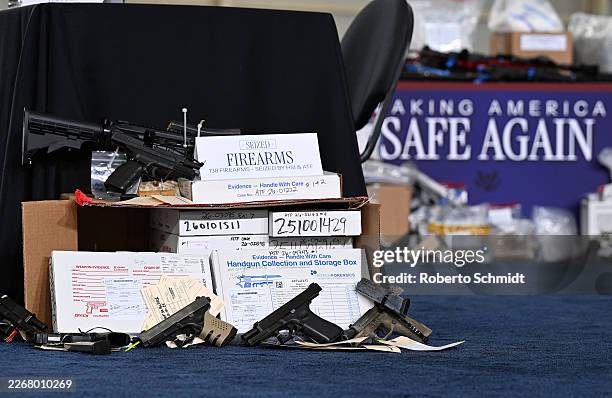 Examples of seized evidence is seen as U.S. President Donald Trump speaks during a Memphis Safe Task Force roundtable on March 23, 2026 in Memphis,...