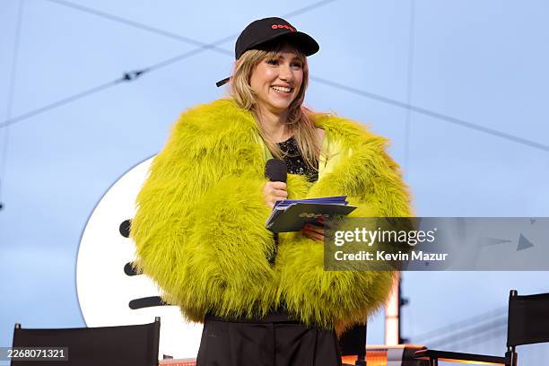 Suki Waterhouse speaks onstage during Spotify x BTS: SWIMSIDE at Pier 17 on March 23, 2026 in New York City.
