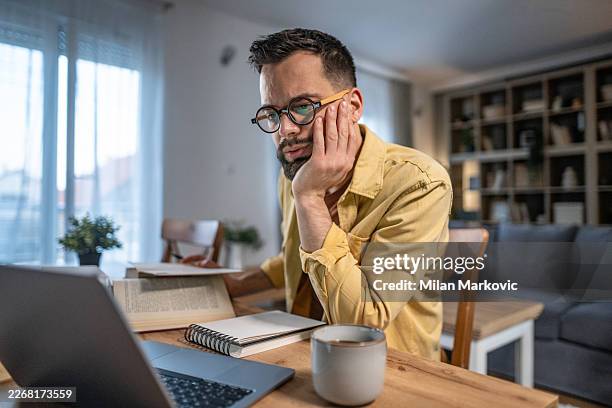 man studying at home, telecommuting and working remotely - beard stock pictures, royalty-free photos & images