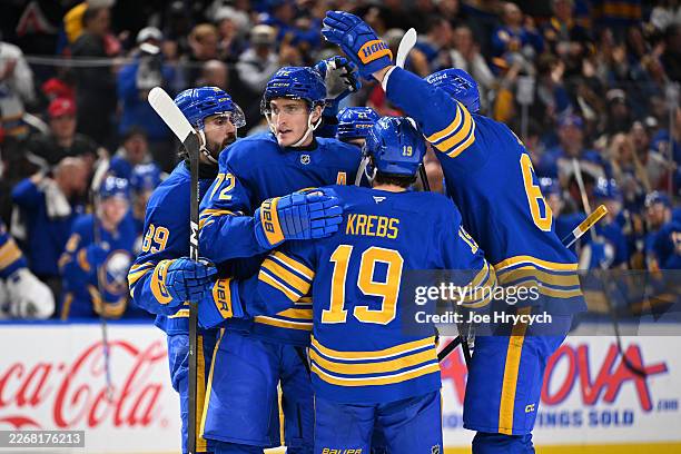 Tage Thompson of the Buffalo Sabres celebrates his goal with teammates during the second period of an NHL game against the Detroit Red Wings at...