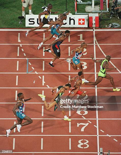 Dennis Mitchell, lane five, crosses the finish line of the100 meter finals at the US Olympic Trials at the Olympic Stadium in Atlanta, Georgia....