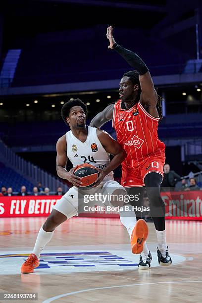 Andres Feliz of Real Madrid and Johnathan Motley of Hapoel Ibi Tel Aviv in action during the EuroLeague Regular Season Round 33 match between Real...