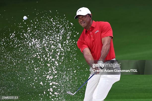 Tiger Woods of Jupiter Links Golf Club plays a shot from a bunker on the eighth hole during the match against the Los Angeles Golf Club at SoFi...