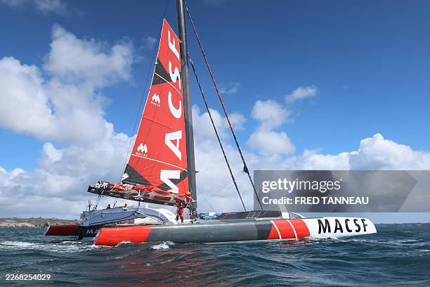 French skipper Guirec Soudée celebrates aboard the maxi-trimaran MACSF shattering the record for sailing around the world from east to west, near...