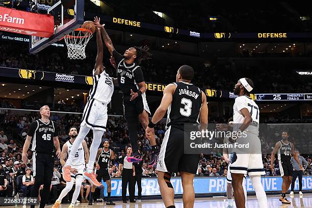 Stephon Castle of the San Antonio Spurs goes to the basket against Taylor Hendricks of the Memphis Grizzlies during the first half at FedExForum on...