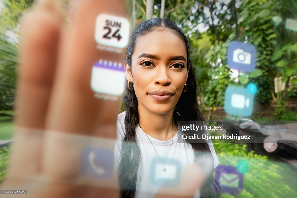 Personal perspective of a young adult woman touching a digital display of mobile phone. Technology concept