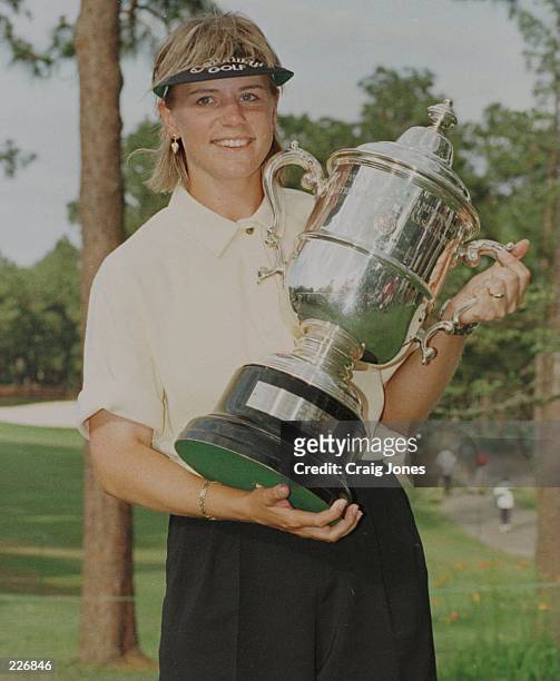 Annika Sorenstam of Sweden holds the championship trophy after capturing the 1996 U.S. Women''s Open at Pines Needles Lodge and Golf Club in Southern...