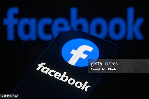The Facebook logo is displayed on a smartphone screen in this photo illustration in Brussels, Belgium, on March 29, 2026. Meta Platforms expands its...