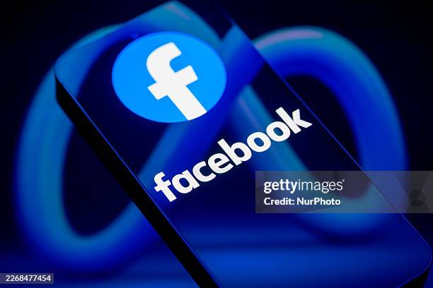 The Facebook logo is displayed on a smartphone screen in this photo illustration in Brussels, Belgium, on March 29, 2026. Meta Platforms expands its...