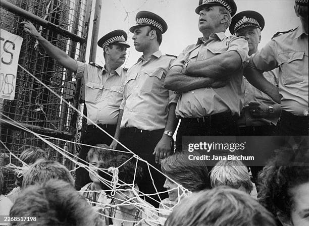 Protesters gather at the women�s peace camp at RAF Greenham Common in Berkshire, England, July 1, 1983. Established in 1981, it grew into a major...
