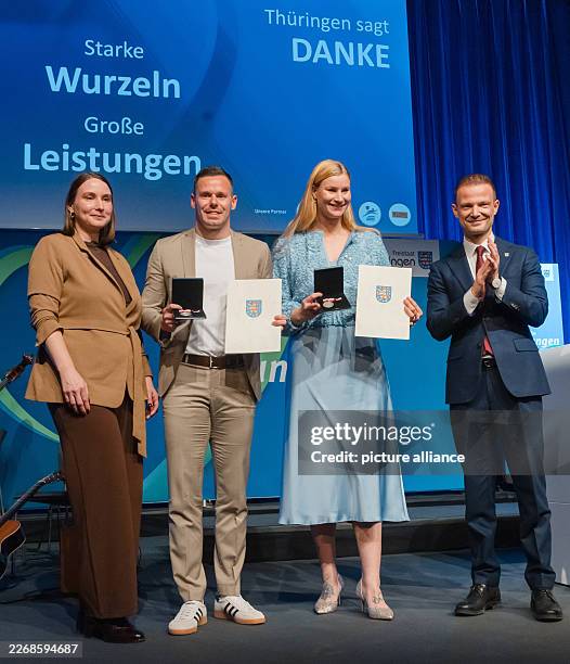 March 2026, Thuringia, Erfurt: Thuringian Olympic medalists Dajana Eitberger and Christopher Grotheer, who have just been awarded the Thuringian...