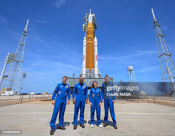 In this handout provided by NASA, NASA astronauts Reid Wiseman, Artemis II commander, left, Victor Glover, Artemis II pilot, Christina Koch, Artemis...