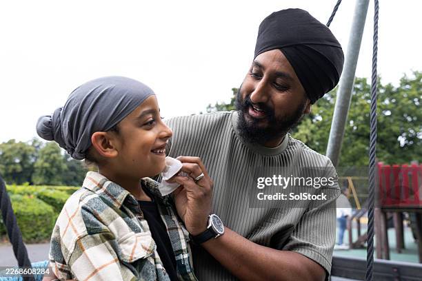 fatherly love - sikhism stock pictures, royalty-free photos & images