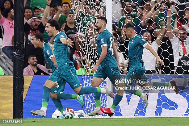 Iraq's forward Aymen Hussein celebrates scoring his team's second goal during the 2026 FIFA World Cup qualifiers final playoff football match between...