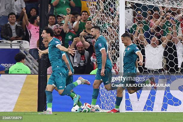 Iraq's forward Aymen Hussein celebrates scoring his team's second goal during the 2026 FIFA World Cup qualifiers final playoff football match between...