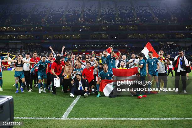 Iraq's players celebrate after winning the 2026 FIFA World Cup qualifiers final playoff football match between Iraq and Bolivia at the BBVA Stadium...