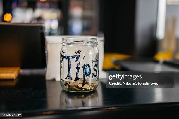 tip jar - gratuity stock pictures, royalty-free photos & images