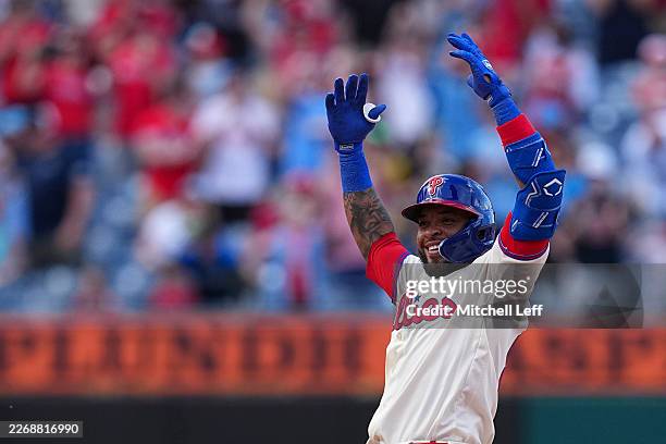 Edmundo Sosa of the Philadelphia Phillies reacts after hitting a two RBI single and advances to second base on an error in the bottom of the ninth...