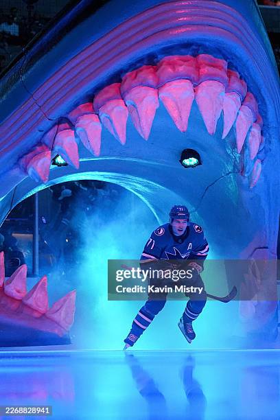 Macklin Celebrini of the San Jose Sharks takes the ice through the Shark Head before the game against the Anaheim Ducks at SAP Center on April 1,...