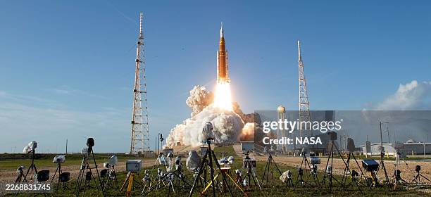 In this handout image provided by NASA, NASA's Space Launch System rocket carrying the Orion spacecraft with NASA astronauts Reid Wiseman, commander;...